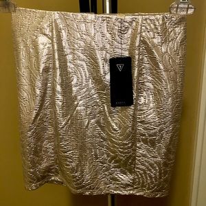 Floral shimmer mini skirt by Guess in gold.